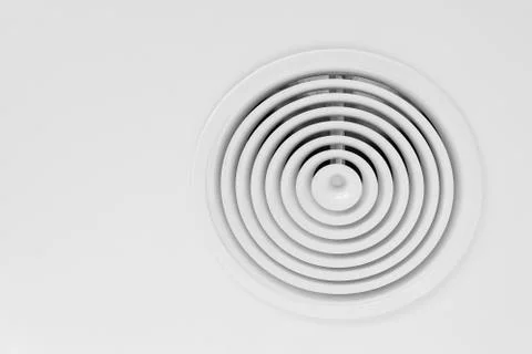 Round ventilation diffuser mounted in white ceiling Stock Photos
