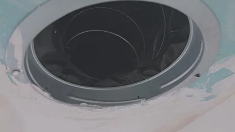 Round ventilation opening with flange and flexible duct in a drywall ceiling Stock Footage 340549782