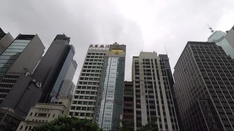 Round view of skyscrapers, camera slides along the top of the buildings, HK Stock Footage 143469471