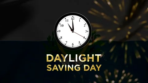 A round wall clock centered above gold daylight saving day text with a dark.. Stock-Footage 346541184