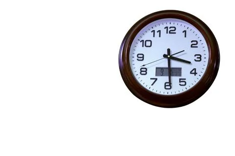 Round wall clock.The minute and second hands.An electronic watch.They show the t Stock Photos