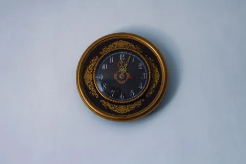 Round wall clock on a white background Stock Photos