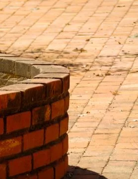 Round walls of rustic brick, on the brick floor Stock Photos