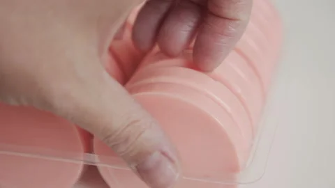 Round wax cake taking from the package 4K footage Stock Footage 139444906