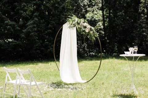 Round wedding arch on a background of trees Stock Photos
