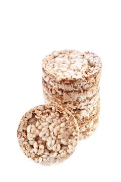 Round wheat crispbread, white background. Composition of crispbread on white Stockfoto's
