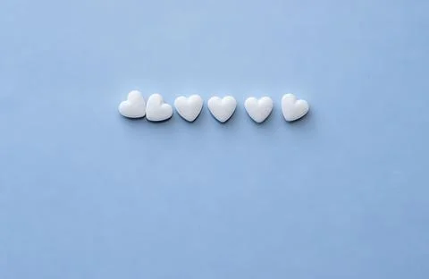 Round white pills,red tablets,heart shape,poured from bottle Stock Photos
