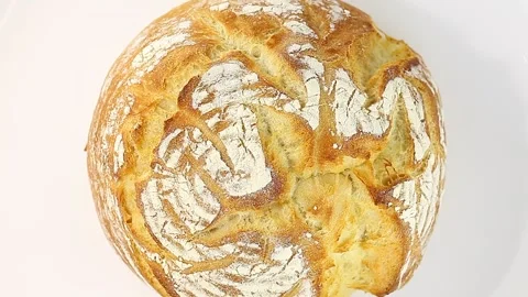 Round white whole bread rotation, turning counterclockwise, on white background 스톡 동영상 149112519