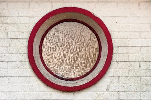 Round window on brick wall building Stock Photos