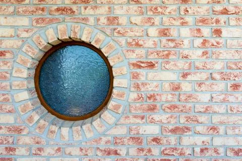 Round window on brick wall Stock Photos