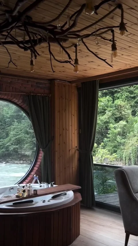 Round Window View of River from Luxury Jacuzzi Tub Stock Footage 340564127
