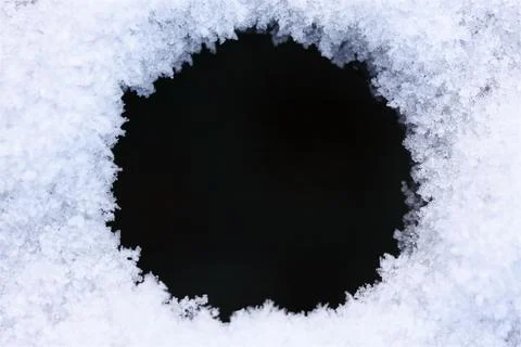 Round winter background frame with border of icy snow texture 스톡 사진