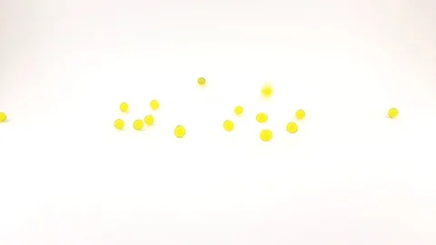 Round yellow pills are falling Stock Footage 125008075
