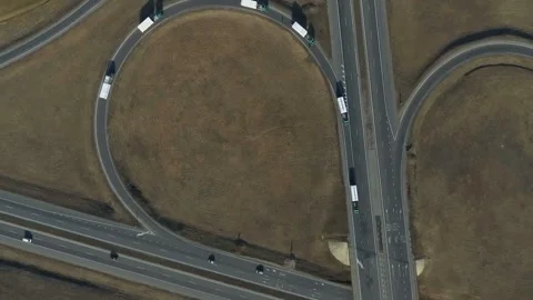 Roundabout aerial top down view footage from above with vehicles circling around Stock Footage 131235495