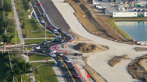 Roundabout intersection construction in North Port, Florida. Development of Stock Footage 271371285