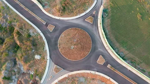 Roundabout junction on an empty road in the middle of nowhere Stock Footage 139113775