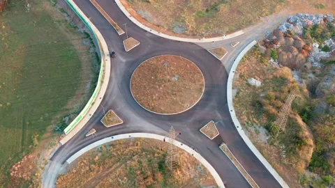 Roundabout junction on an empty road in the middle of nowhere Stock Footage 139117363
