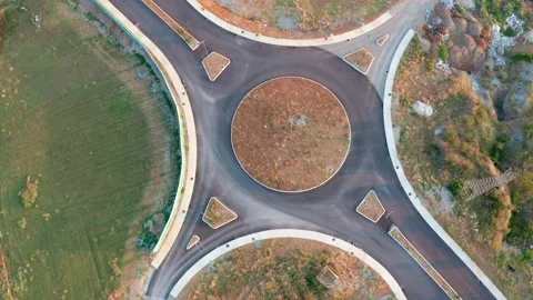 Roundabout junction on an empty road in the middle of nowhere Stock Footage 139118800