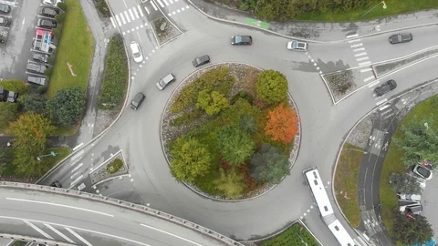 Roundabout road intersection with vehicle traffic aerial view from drone Stock Footage 118650297