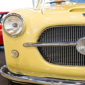 Rounded lines and round headlights of a vintage car Stock Photos