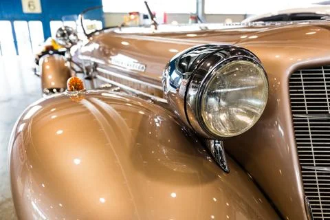 Rounded lines and round headlights of a vintage car Stock Photos