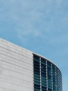 Rounded lines of modern architecture building in Madrid Spain vertical photo Stock Photos