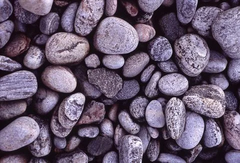 Rounded pebbles background texture and pattern Stock Photos