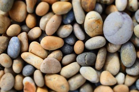 Rounded pebbles on beach Stock Photos