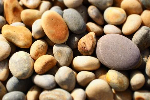 Rounded pebbles on beach Stock Photos