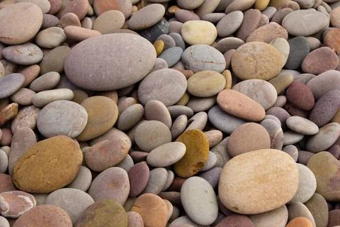 Rounded pebbles at the beach Stockfoto's