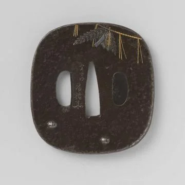 . Rounded rectangular tsuba with slightly elevated edge; On the front in i... 스톡 사진