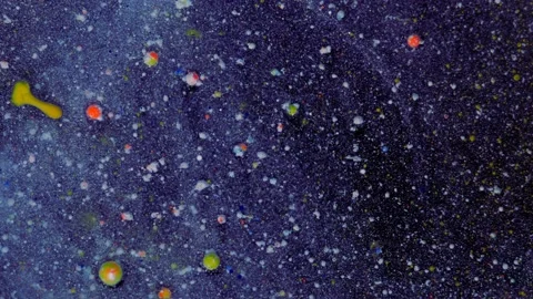 Rounded red, yellow particles on a blue-white background with sequins. Christmas Stock Footage 168762944