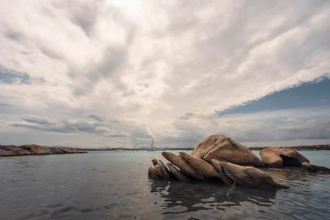 Rounded rocks in front of the beach Stock Photos
