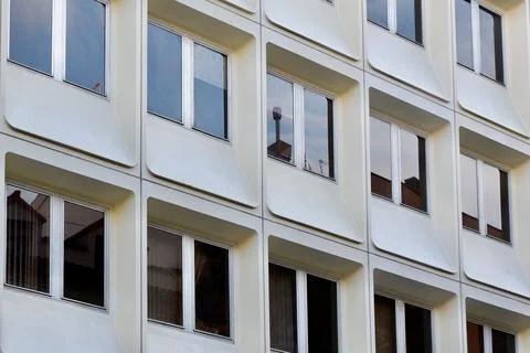 Rounded windows on white facade in modernist architectural style in Zaragoz.. Stock Photos