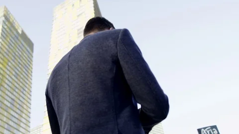 Rounding view of man uses his smartphone and looking at sky Stock Footage 73729412