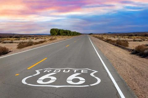 Route 66 shield marker on the highway in the Mojave Desert Stock Photos