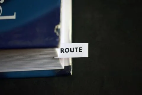 Route Concept Bookmark Inserted in Book Representing Direction, Travel Path.. Stock Photos