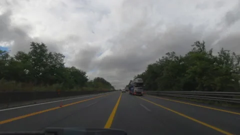 Route on highway A1 with cloudy weather in Italy Stock Footage 141145708