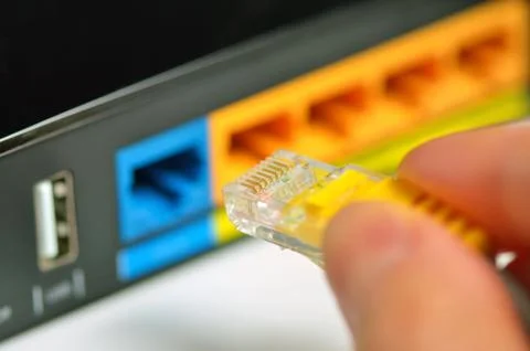 Router network hub with patch cable Stock Photos