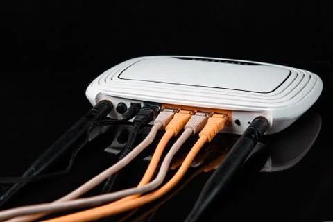 Router with wires, cable for Internet with reflection , isolated on black bac Stock Photos