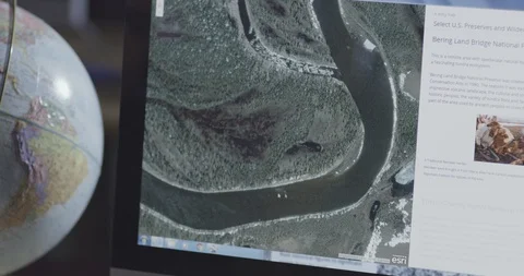 Routes being checked on the aerial maps on computer Stock Footage 104336370