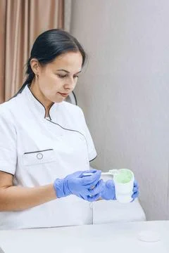 Routine and expert methods a cosmetologist employs to ensure optimal treatment Stock Photos