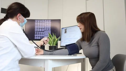 Routine blood pressure examination Video stock 335172664