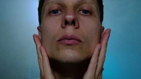 Routine for men. Man applying aftershave cream Stock-Footage 312329760