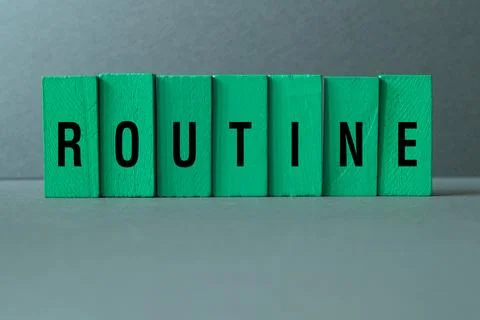 Routine - word concept on building blocks, text Stock Photos