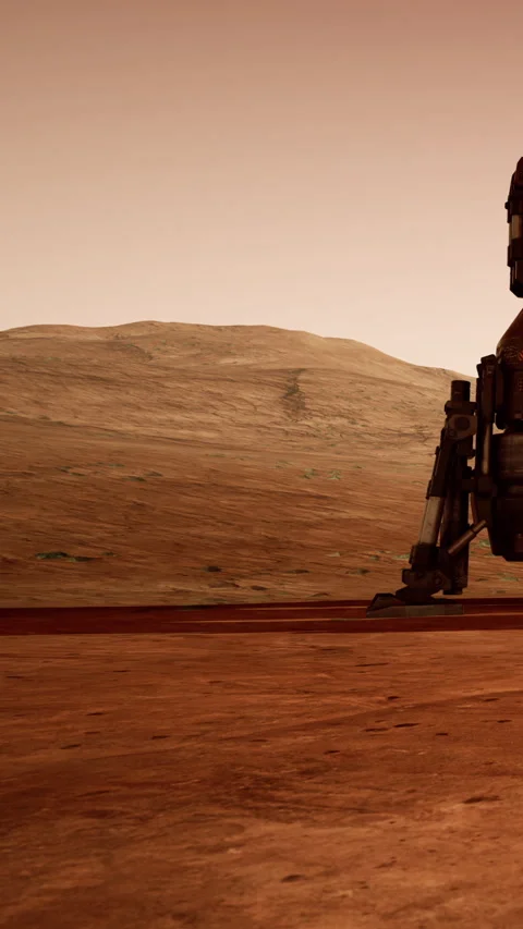 A rover navigates the rocky terrain of Mars under a clear sky Stock Footage 342102202