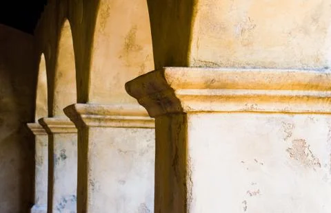 Row of adobe columns and arches Stock Photos
