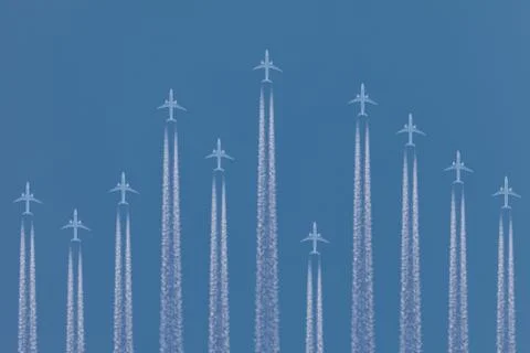 Row of airplanes flying by Stock Photos