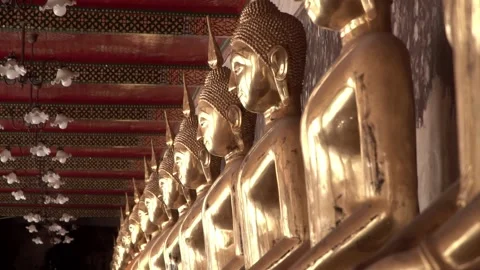 Row of ancient buddha statues in buddhist temple Video stock 347711258