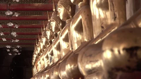 Row of ancient buddha statues in buddhist temple Video stock 347713225